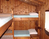 Le camere del Rifugio Buzzoni: una da 4 posti letto, una da 6 posti letto e un camerone da 15 posti letto